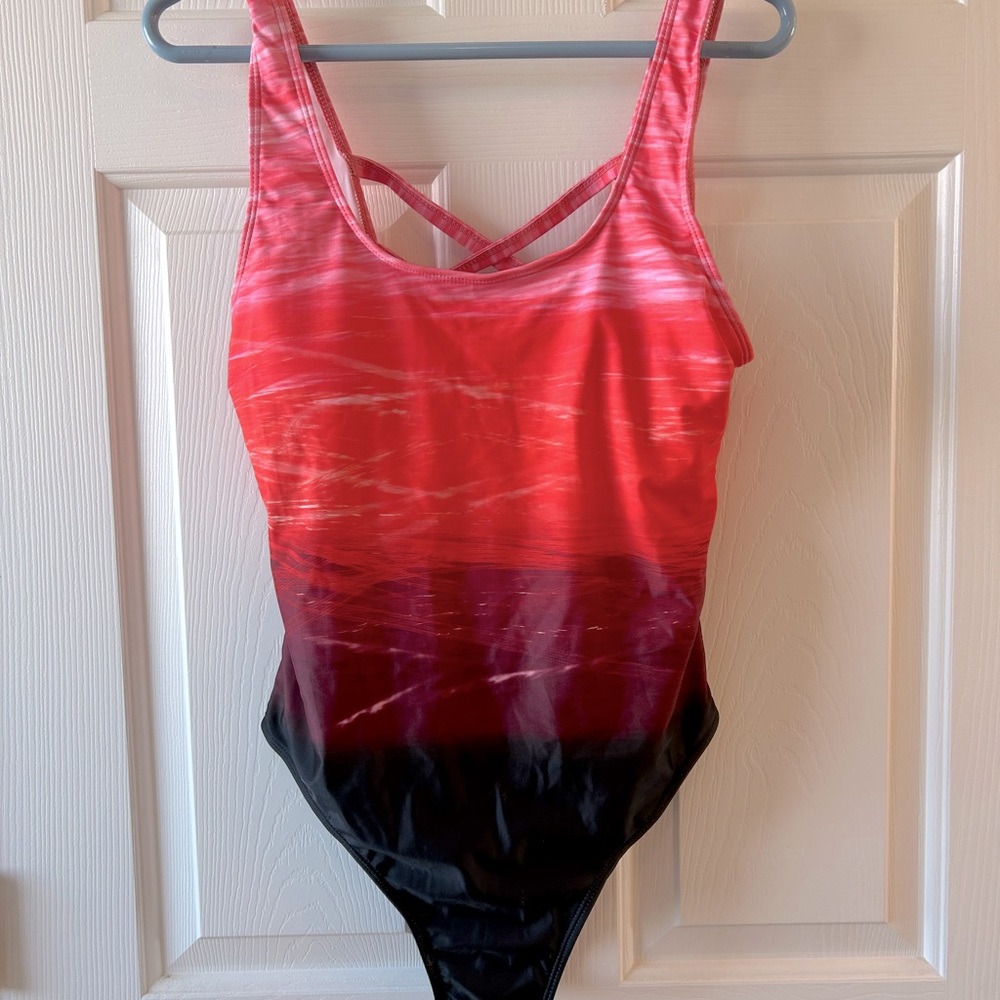 One piece swimsuit. Tag missing but panty guard in place.